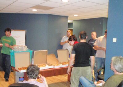 People eating pizza in a new office